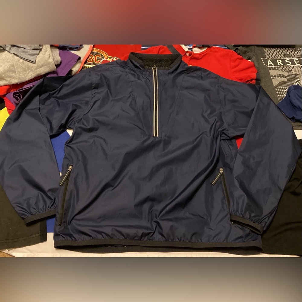 Nike Half zip pullover windbreaker size large 12-14. Navy blue front zip pockets